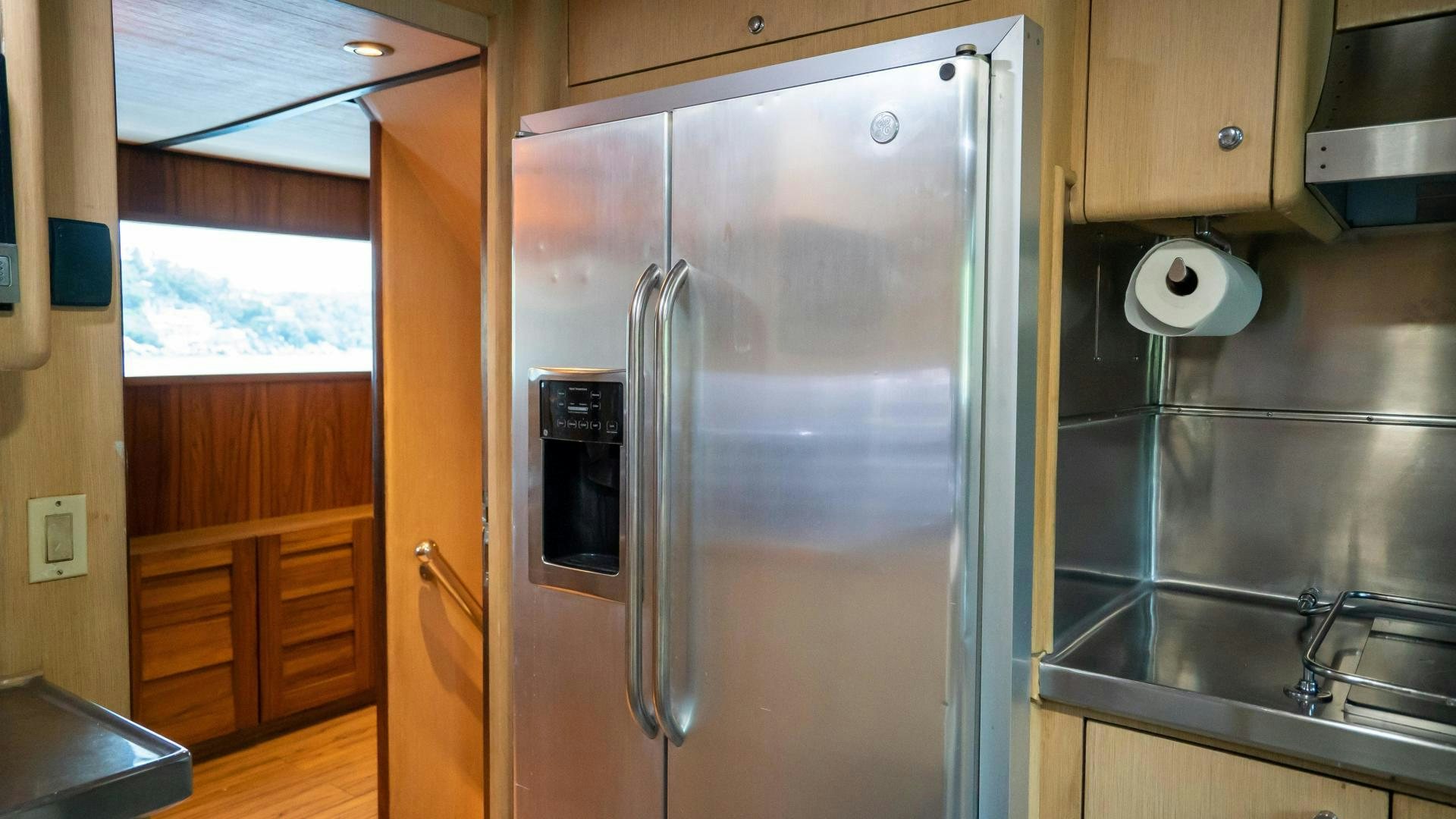 a stainless steel refrigerator in a kitchen aboard MARAZUL Yacht for Sale
