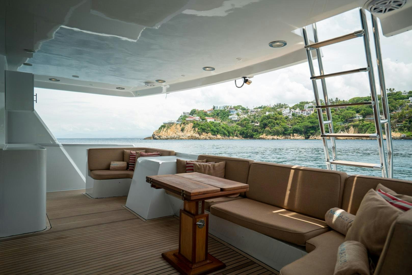 a living room with a large glass window aboard MARAZUL Yacht for Sale