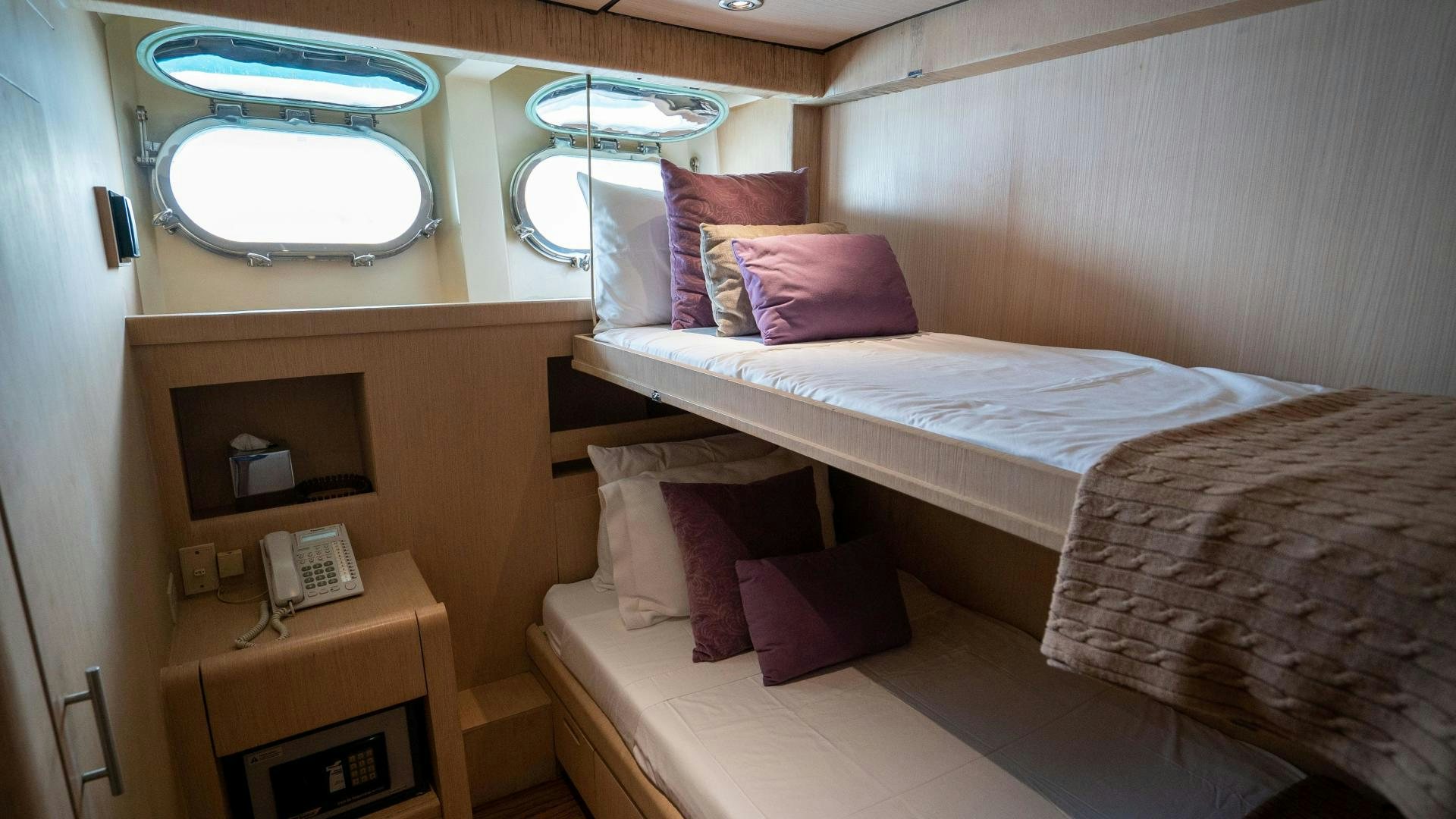 a couple of beds in a room aboard MARAZUL Yacht for Sale