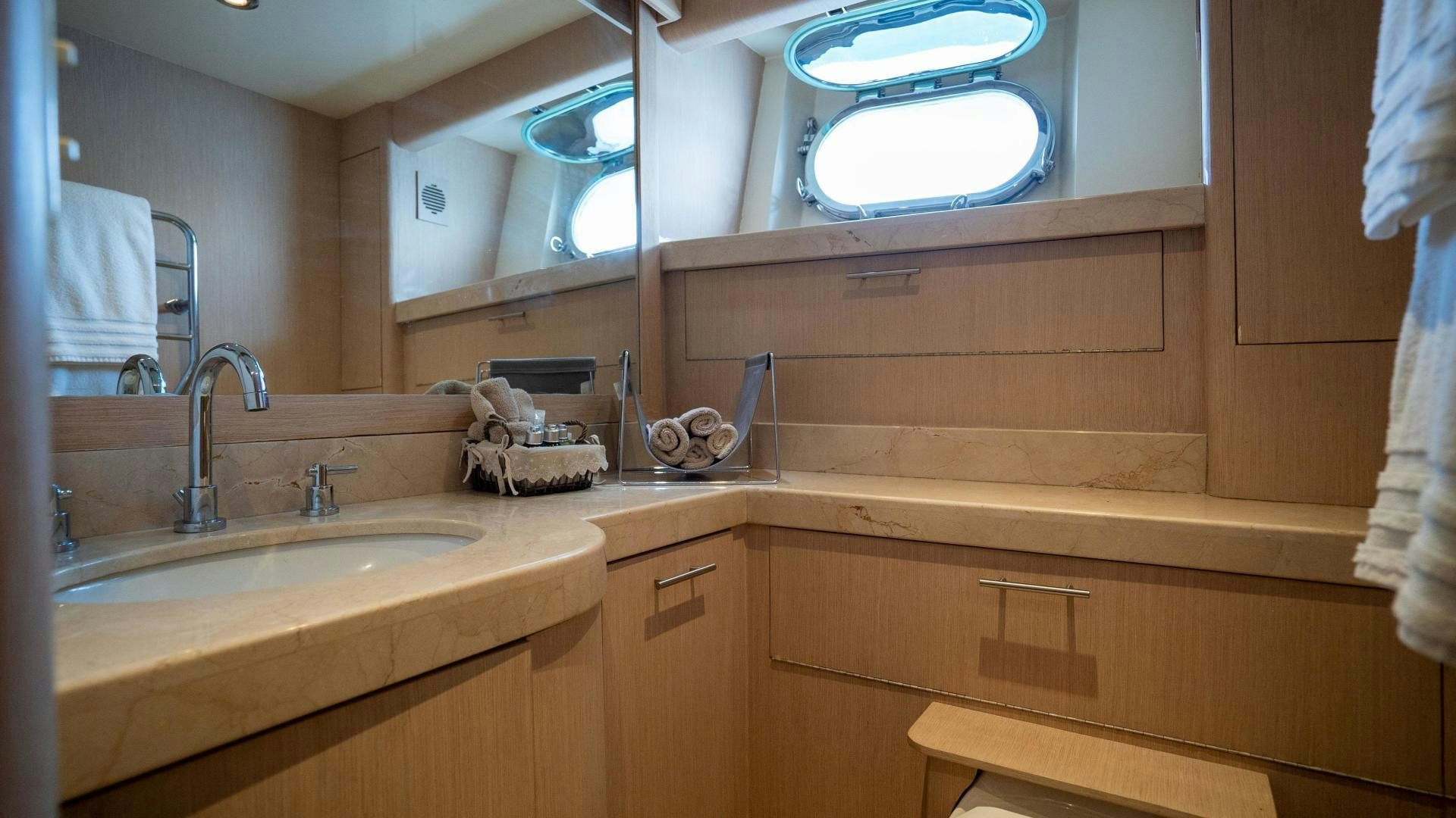 a bathroom with a sink and a mirror aboard MARAZUL Yacht for Sale