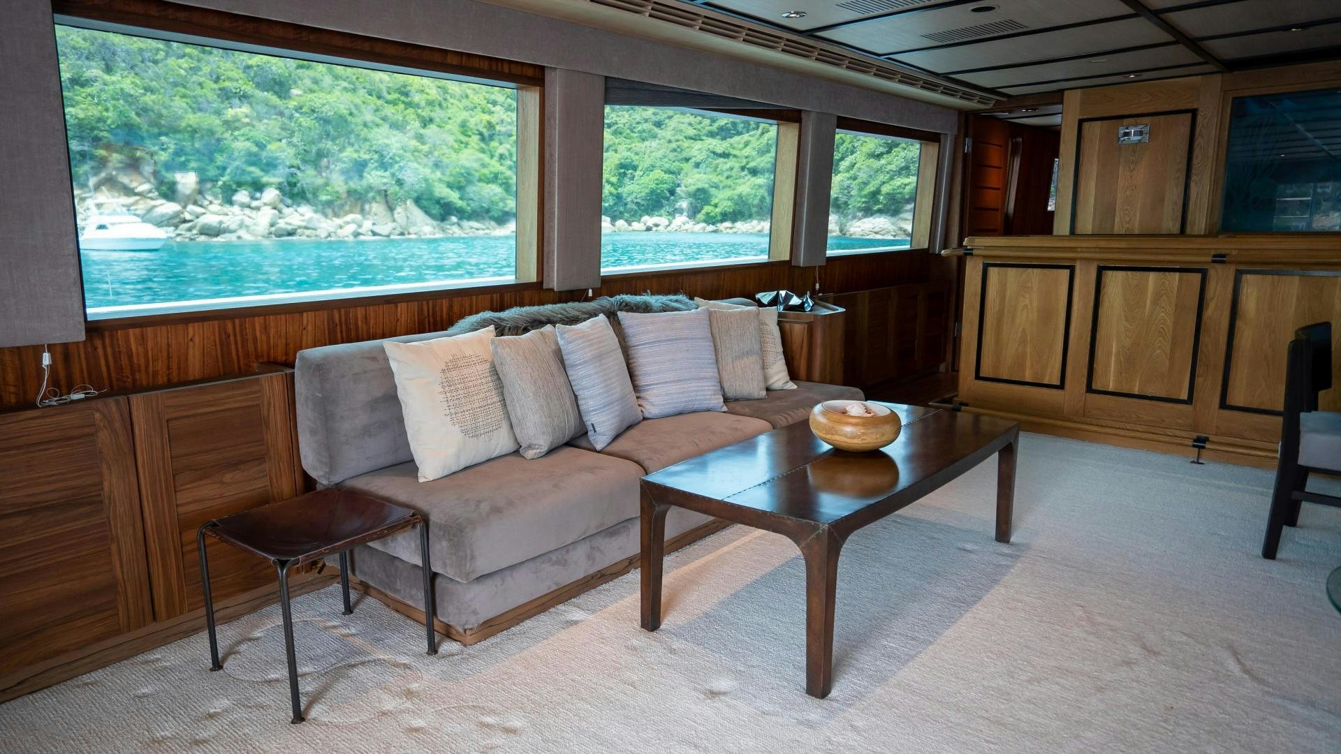 a living room with a couch and coffee table aboard MARAZUL Yacht for Sale