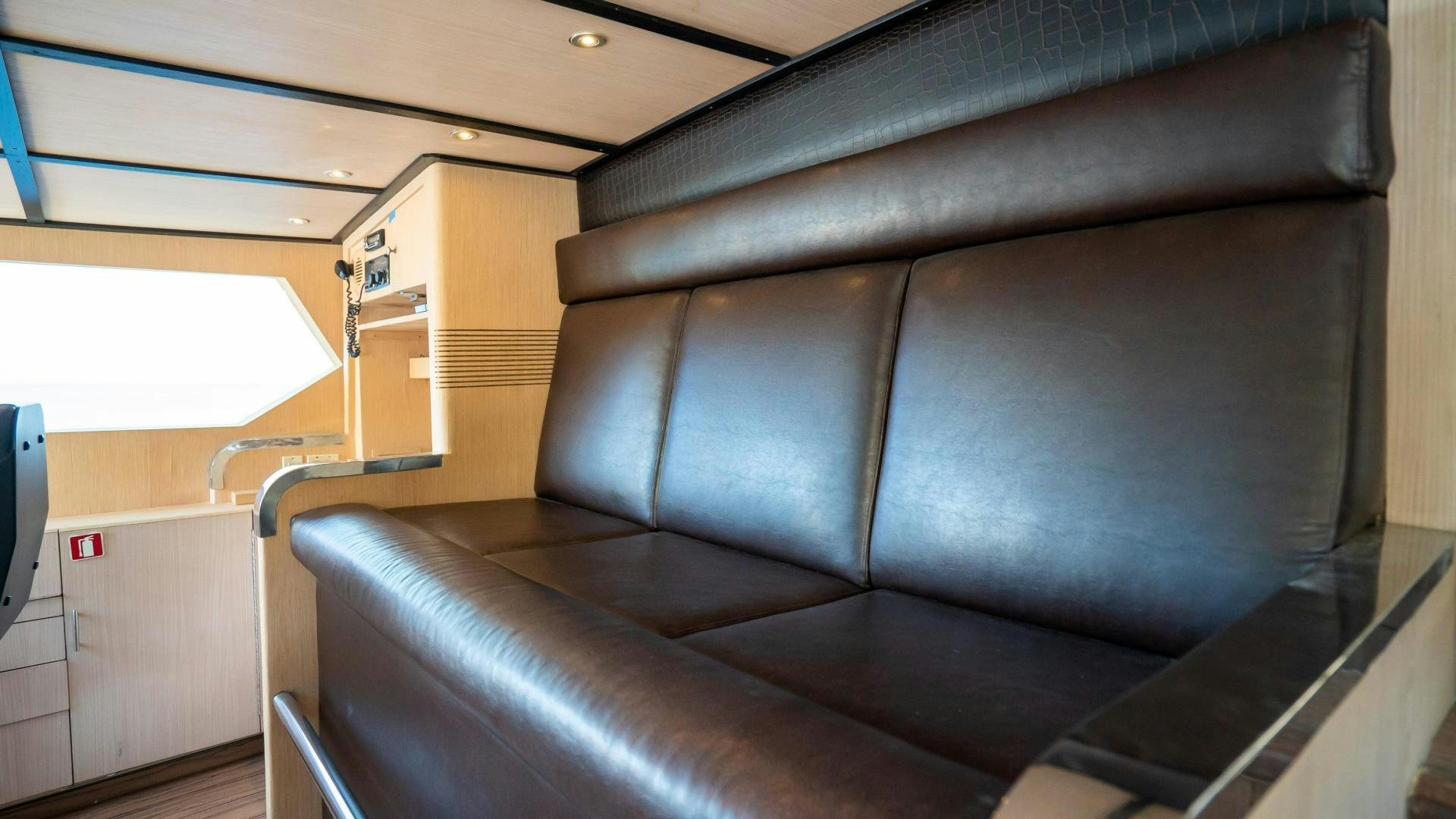 a leather couch in a room aboard MARAZUL Yacht for Sale
