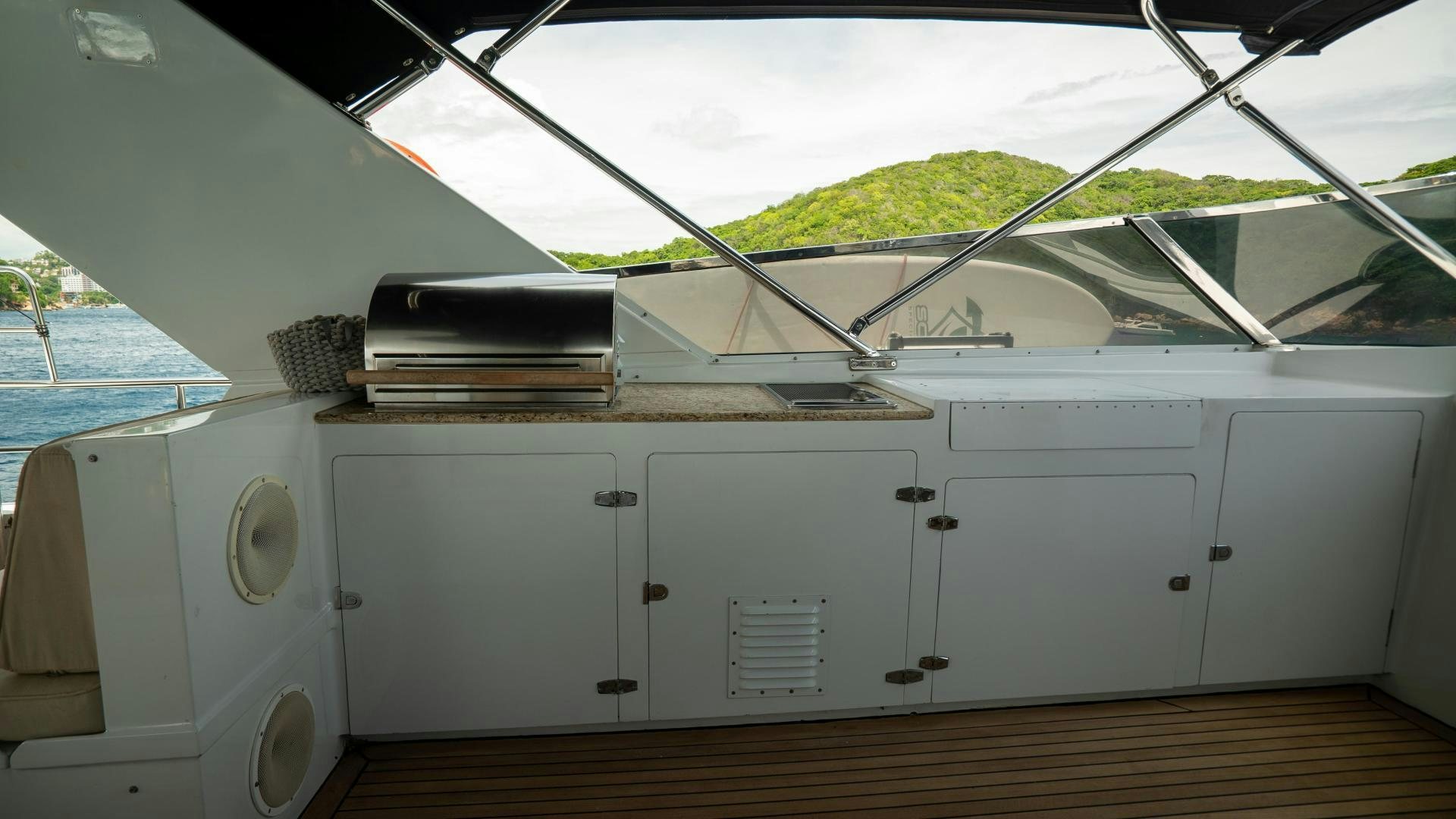 a white car with a large stack of books on top aboard MARAZUL Yacht for Sale