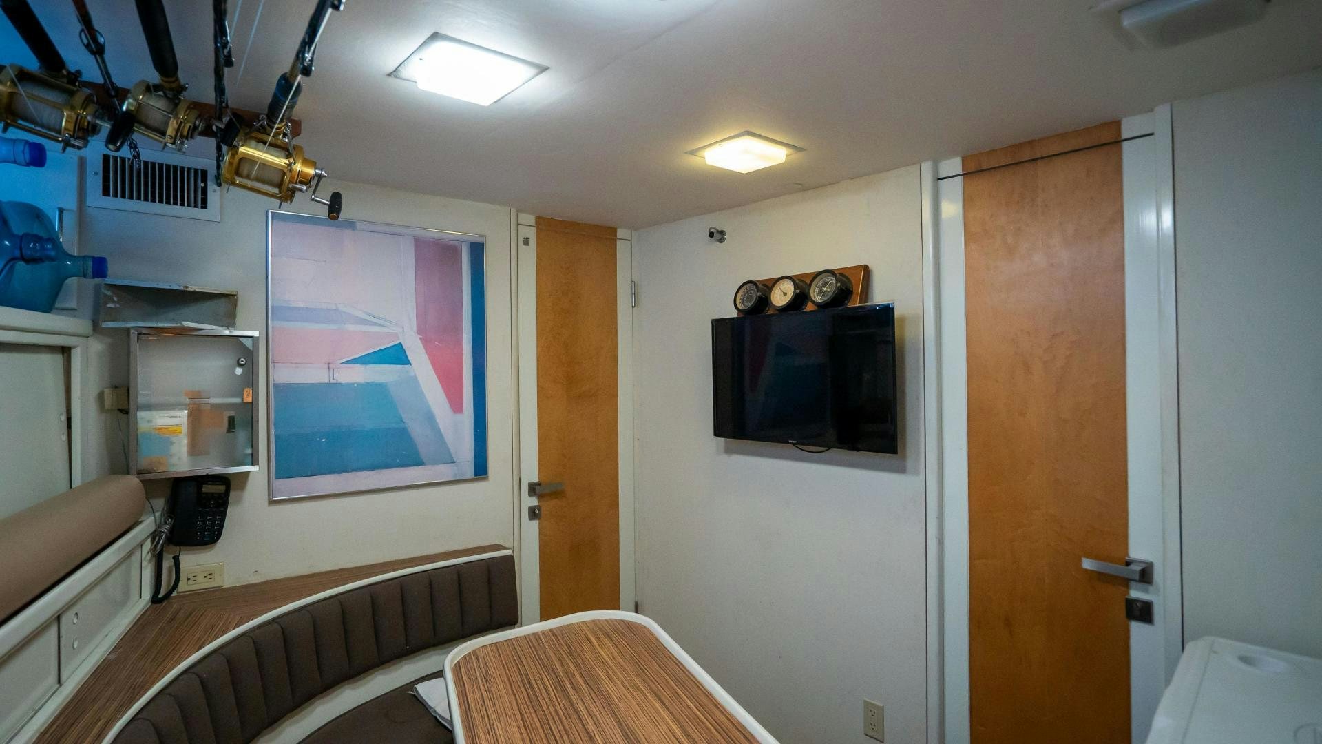 a room with a television and a bed aboard MARAZUL Yacht for Sale