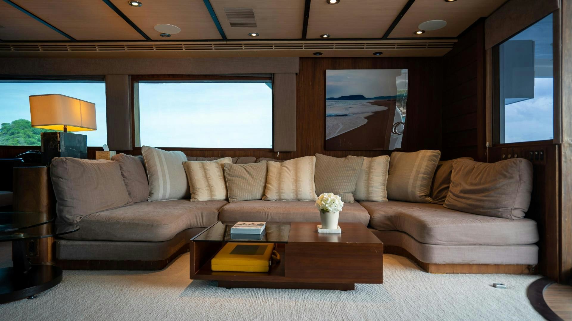 a living room with a couch and a coffee table aboard MARAZUL Yacht for Sale