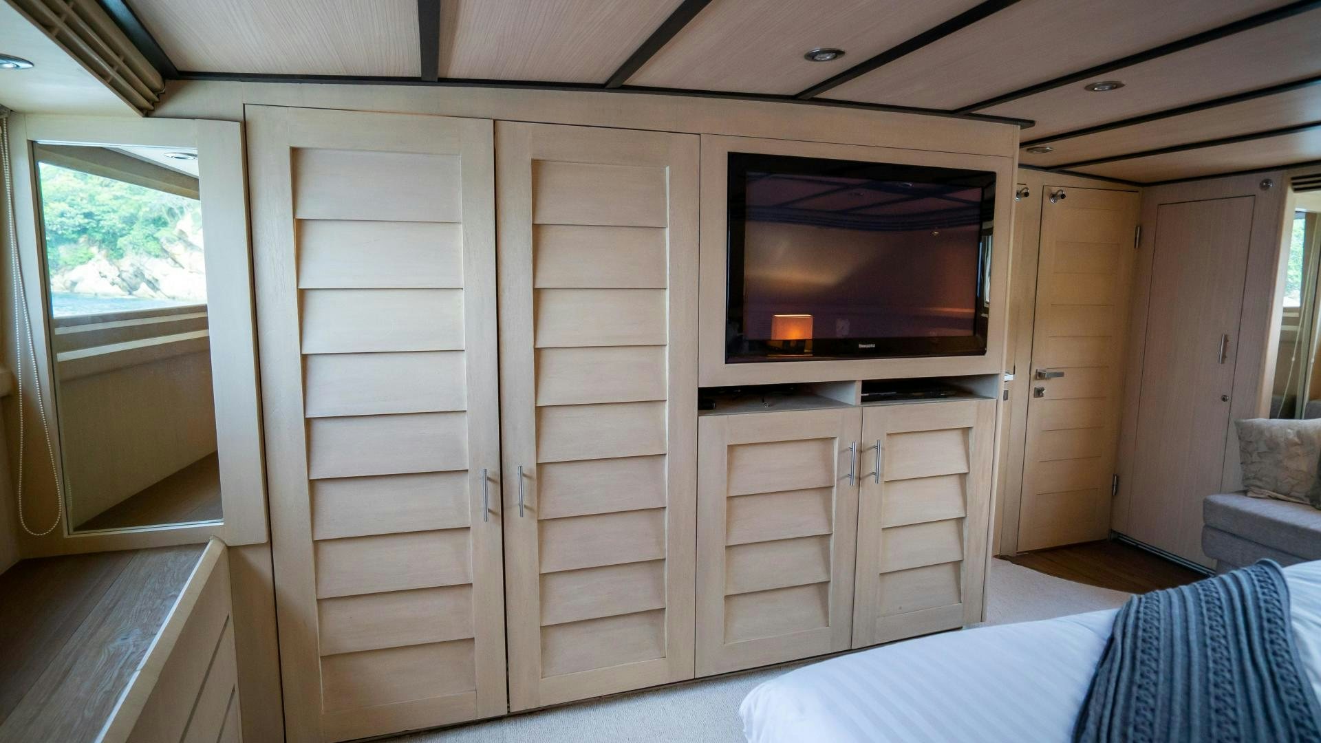 a room with a bed and a tv aboard MARAZUL Yacht for Sale