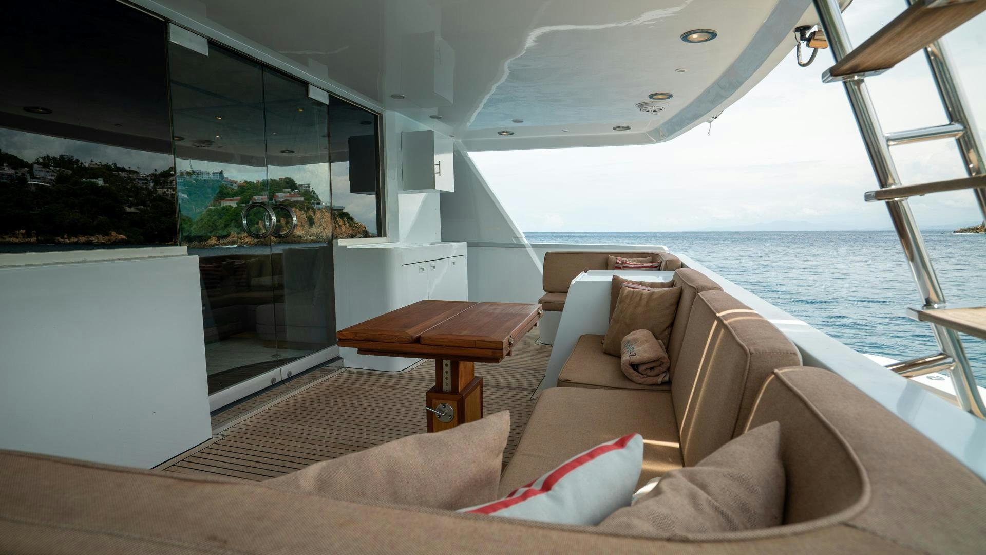 a living room with a large glass window aboard MARAZUL Yacht for Sale