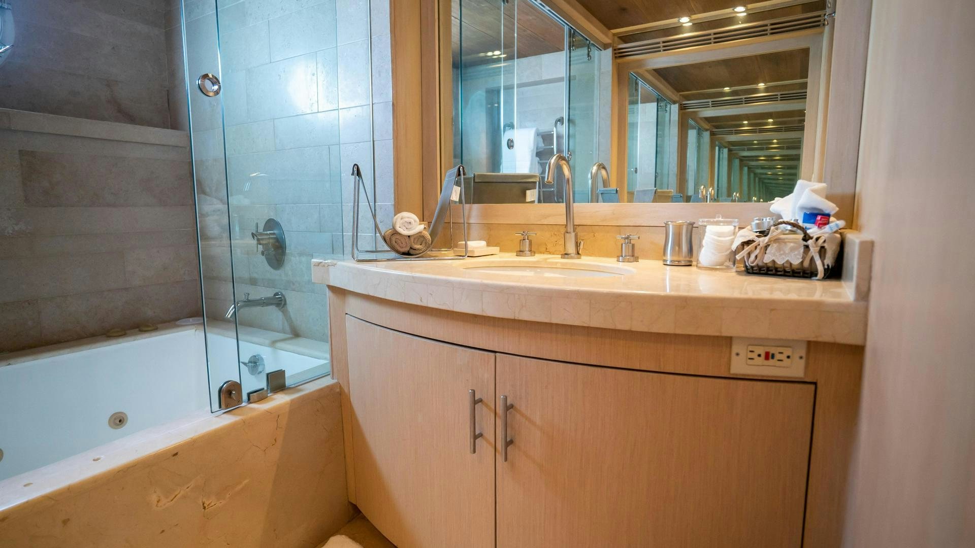 a bathroom with a sink and bathtub aboard MARAZUL Yacht for Sale