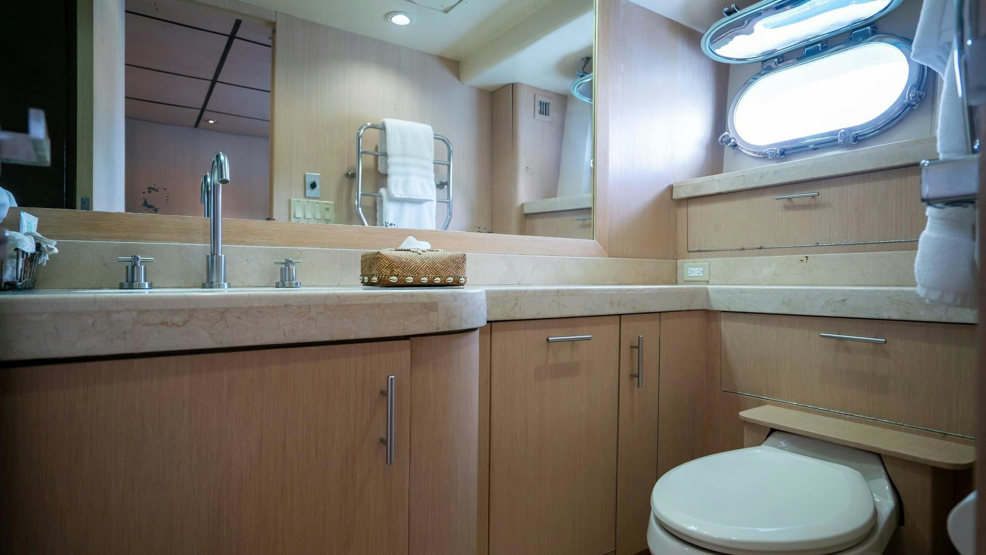 a bathroom with a toilet and a sink aboard MARAZUL Yacht for Sale