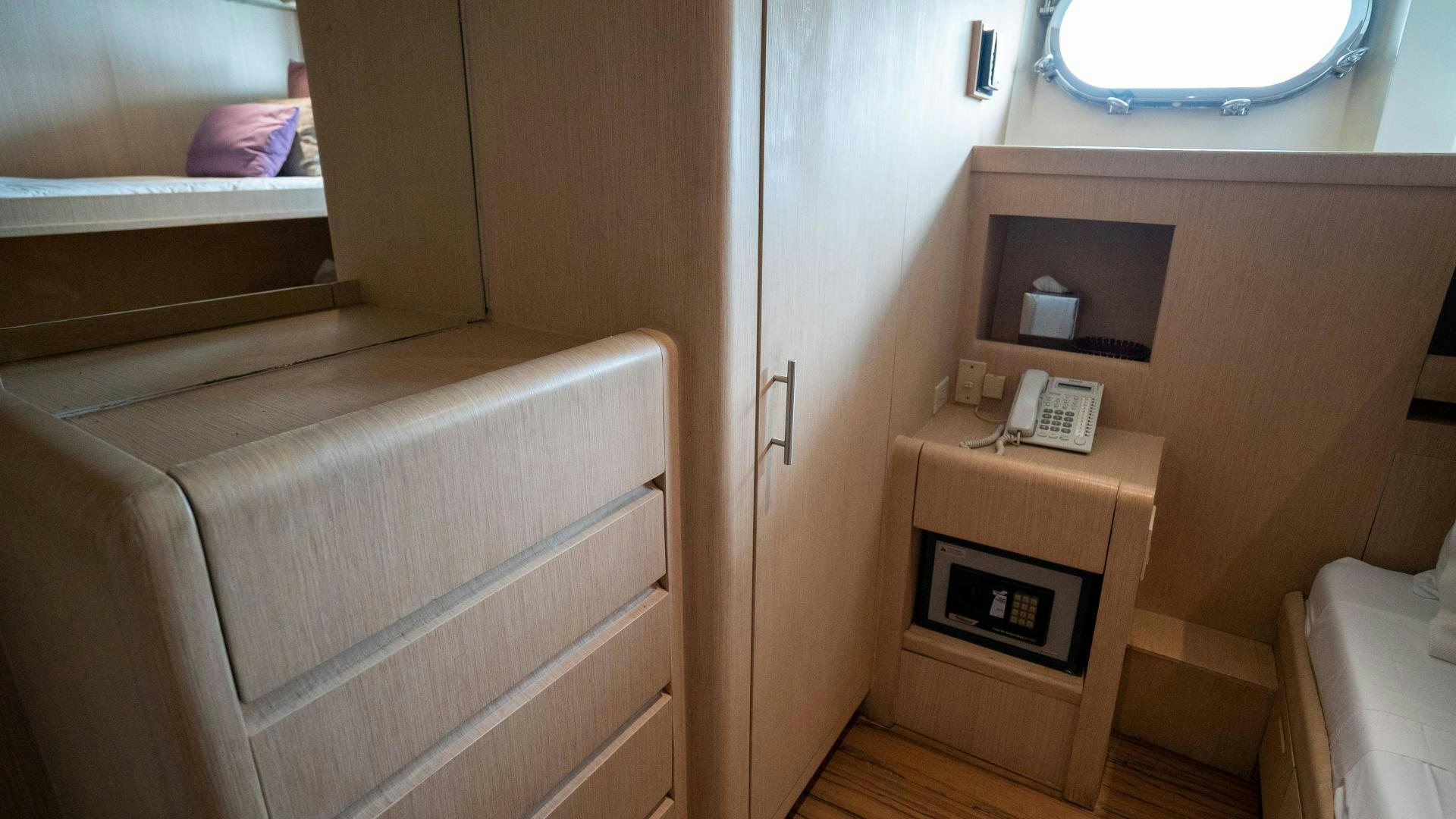 a room with a phone and a bed aboard MARAZUL Yacht for Sale