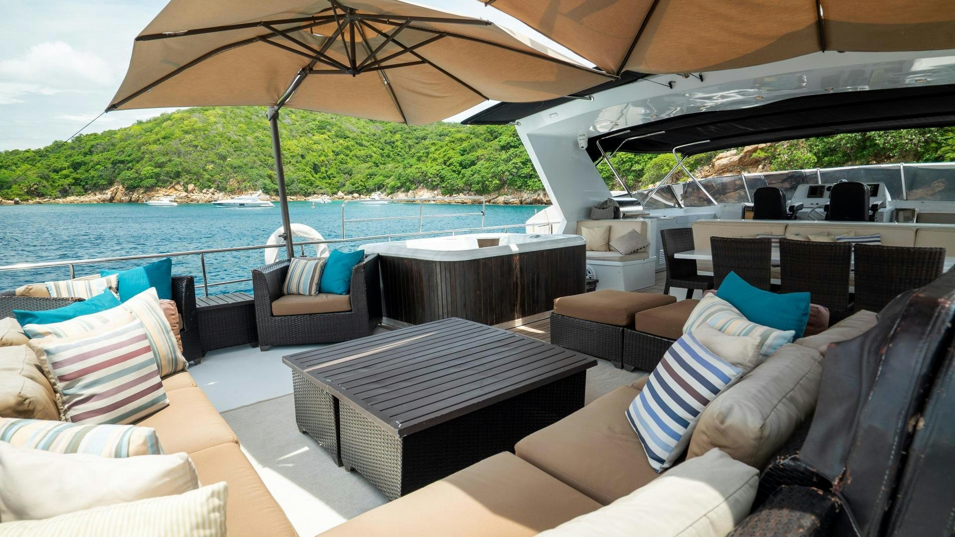 a boat with a table and chairs on it aboard MARAZUL Yacht for Sale