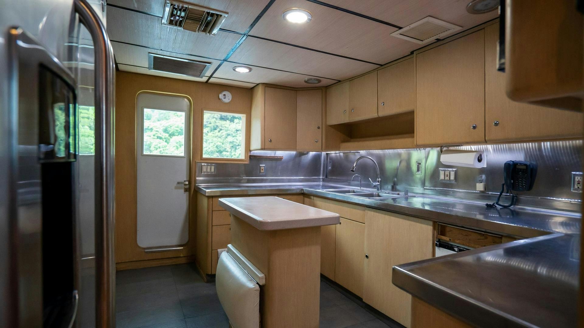 a kitchen with a sink and cabinets aboard MARAZUL Yacht for Sale