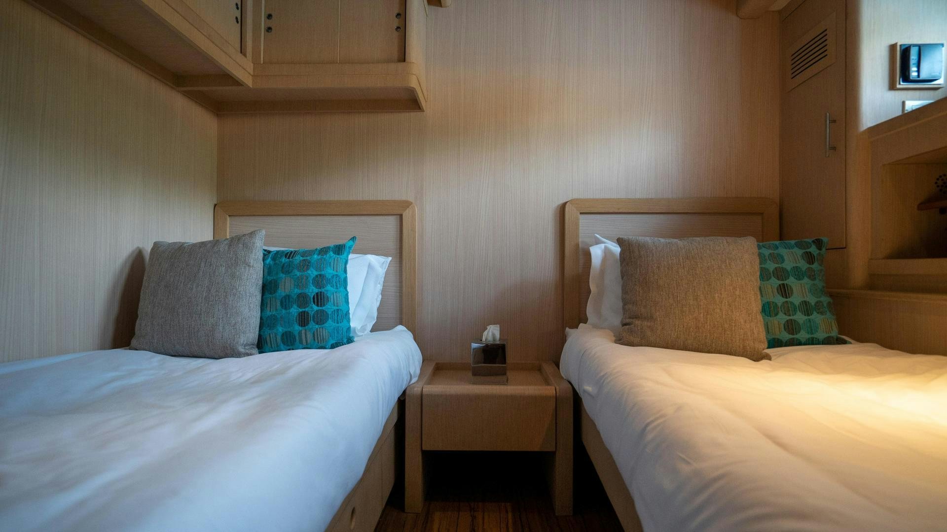 a couple of beds in a room aboard MARAZUL Yacht for Sale