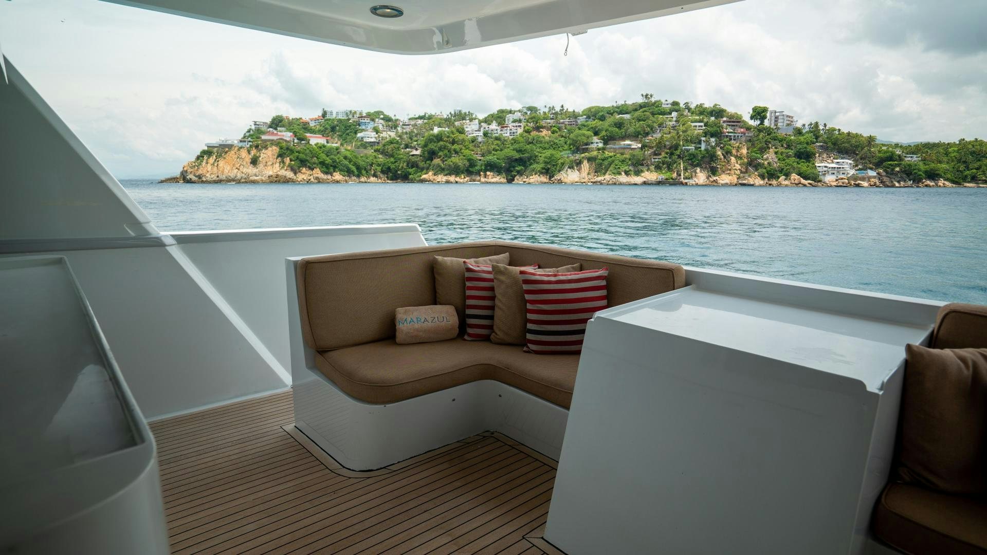 a room with a view of the ocean and a beach aboard MARAZUL Yacht for Sale