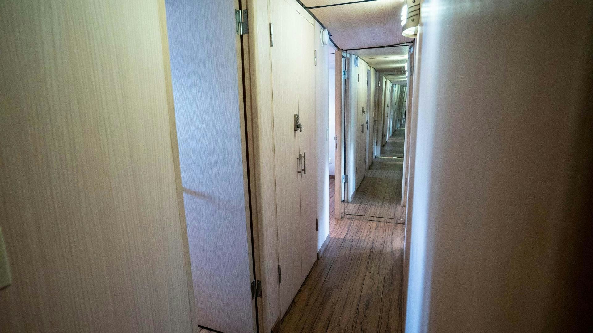 a hallway with white doors aboard MARAZUL Yacht for Sale