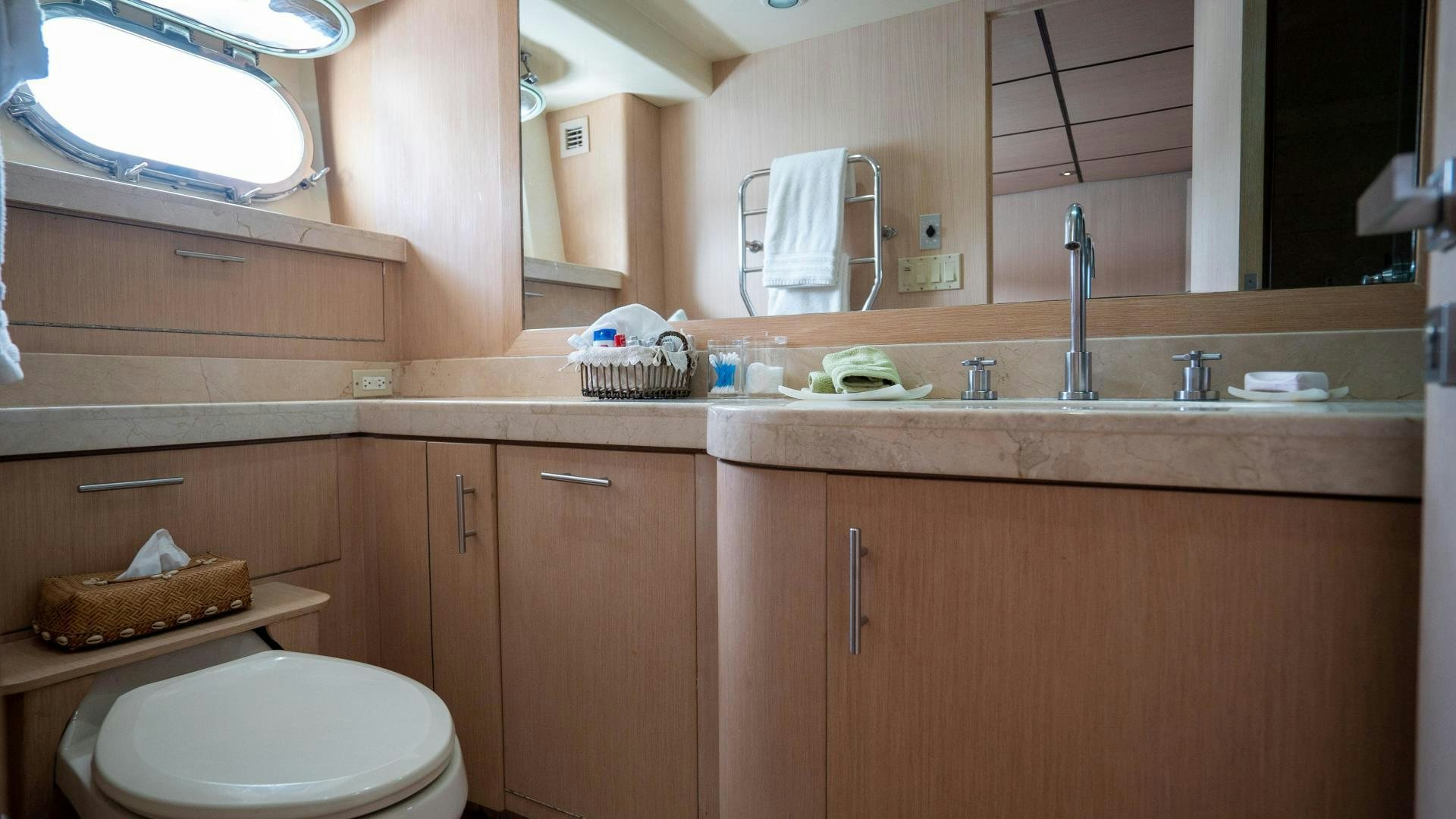 a bathroom with a toilet and a sink aboard MARAZUL Yacht for Sale