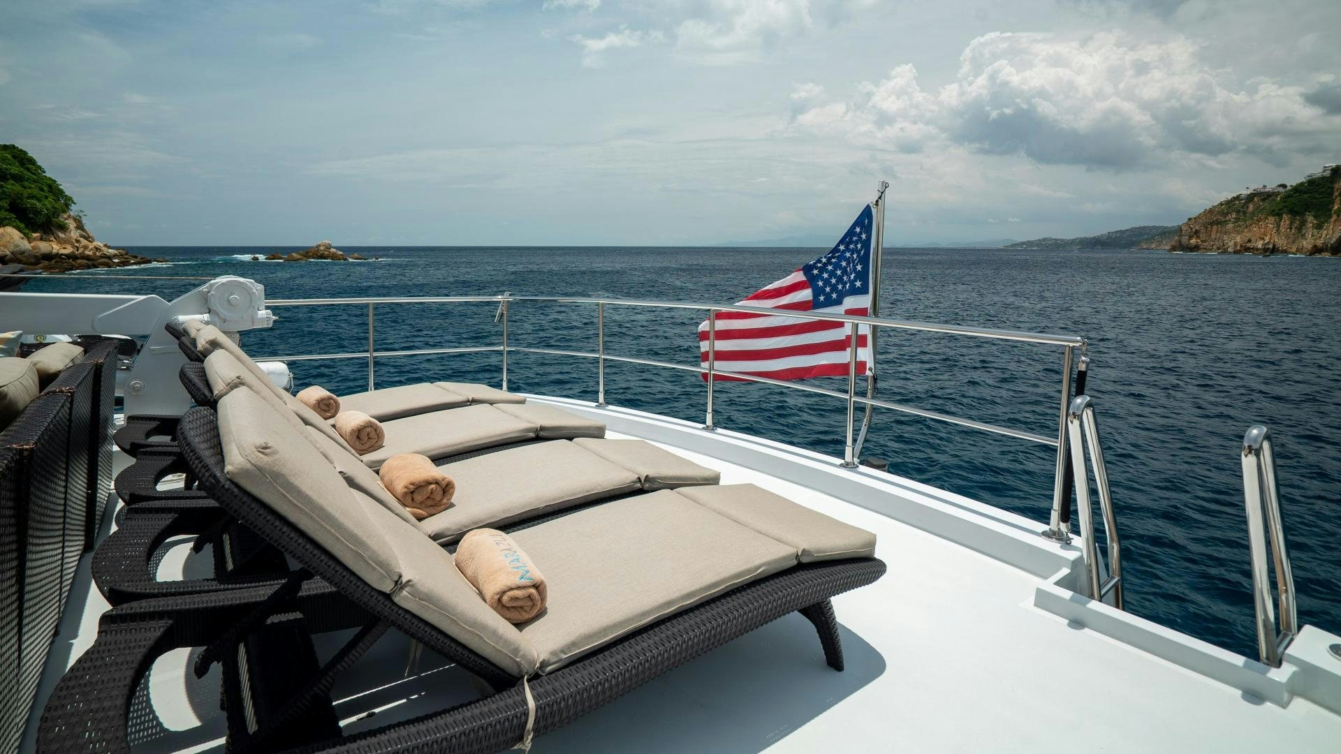 a boat with a flag on the front aboard MARAZUL Yacht for Sale