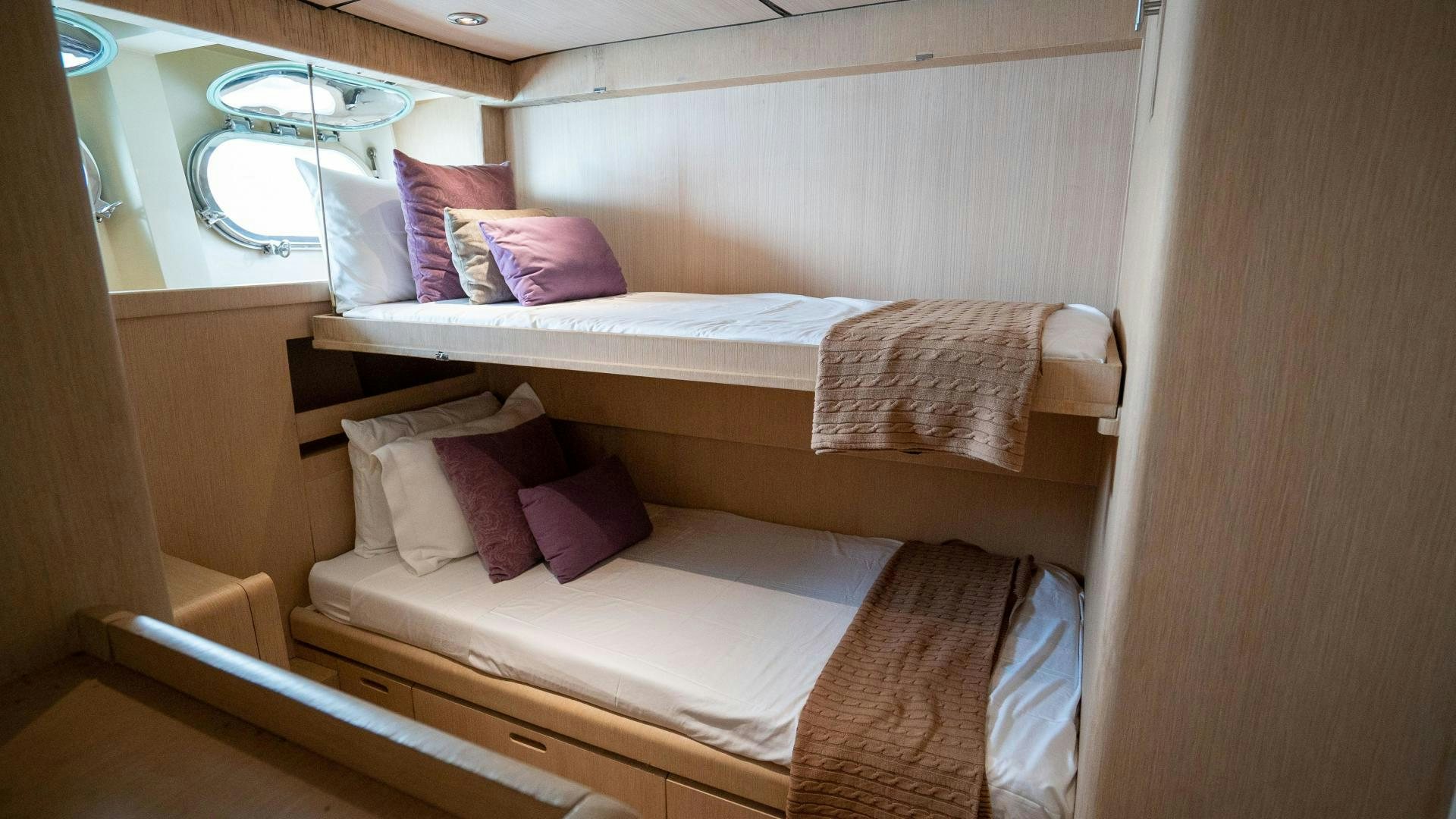 a couple of beds in a room aboard MARAZUL Yacht for Sale