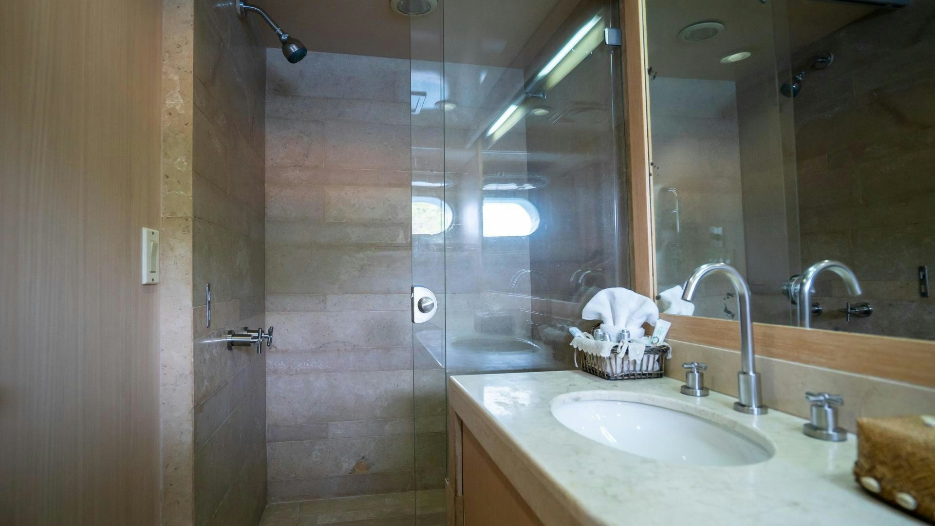 a bathroom with a shower and sink aboard MARAZUL Yacht for Sale
