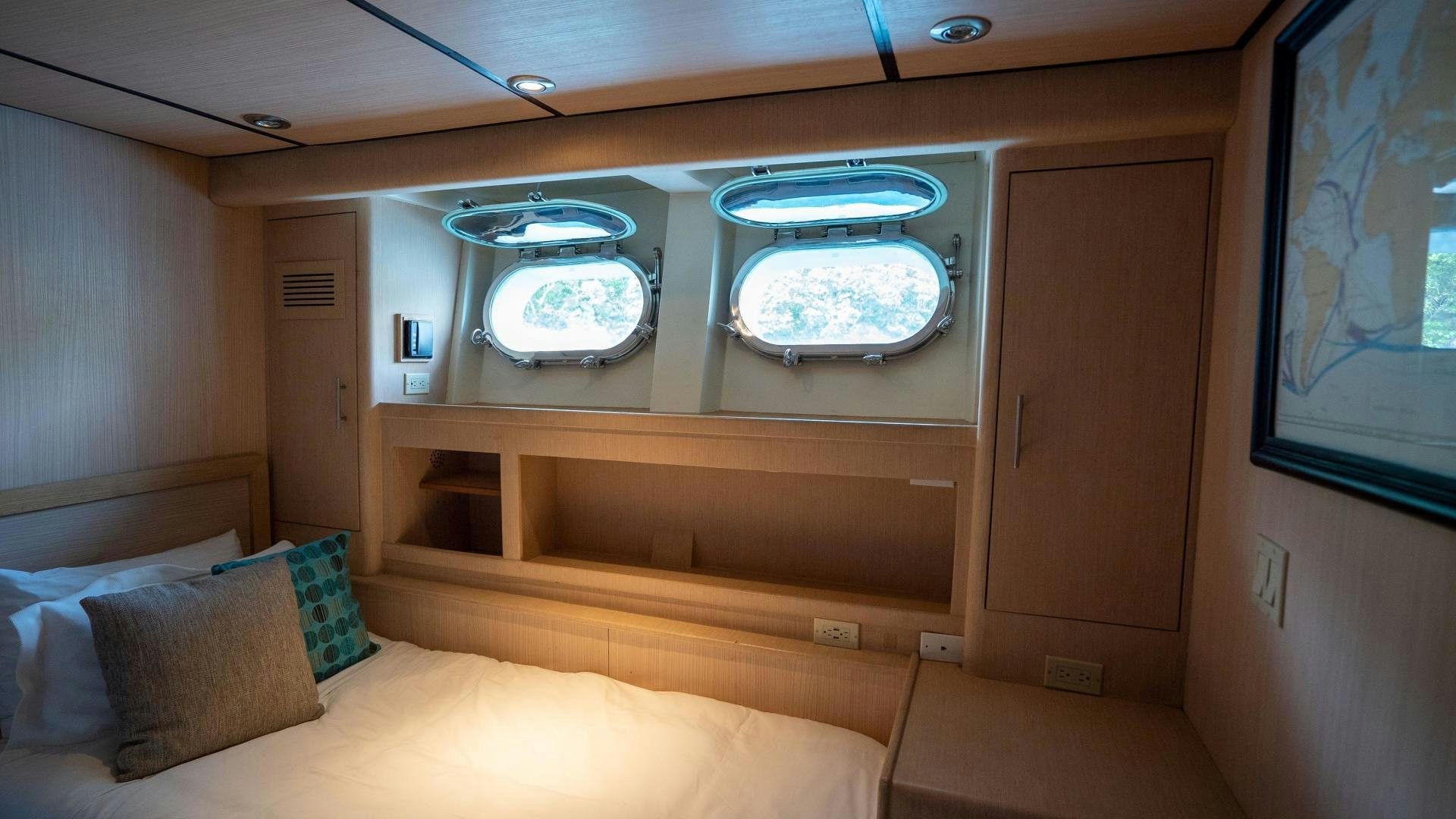 a room with a bed and a television aboard MARAZUL Yacht for Sale