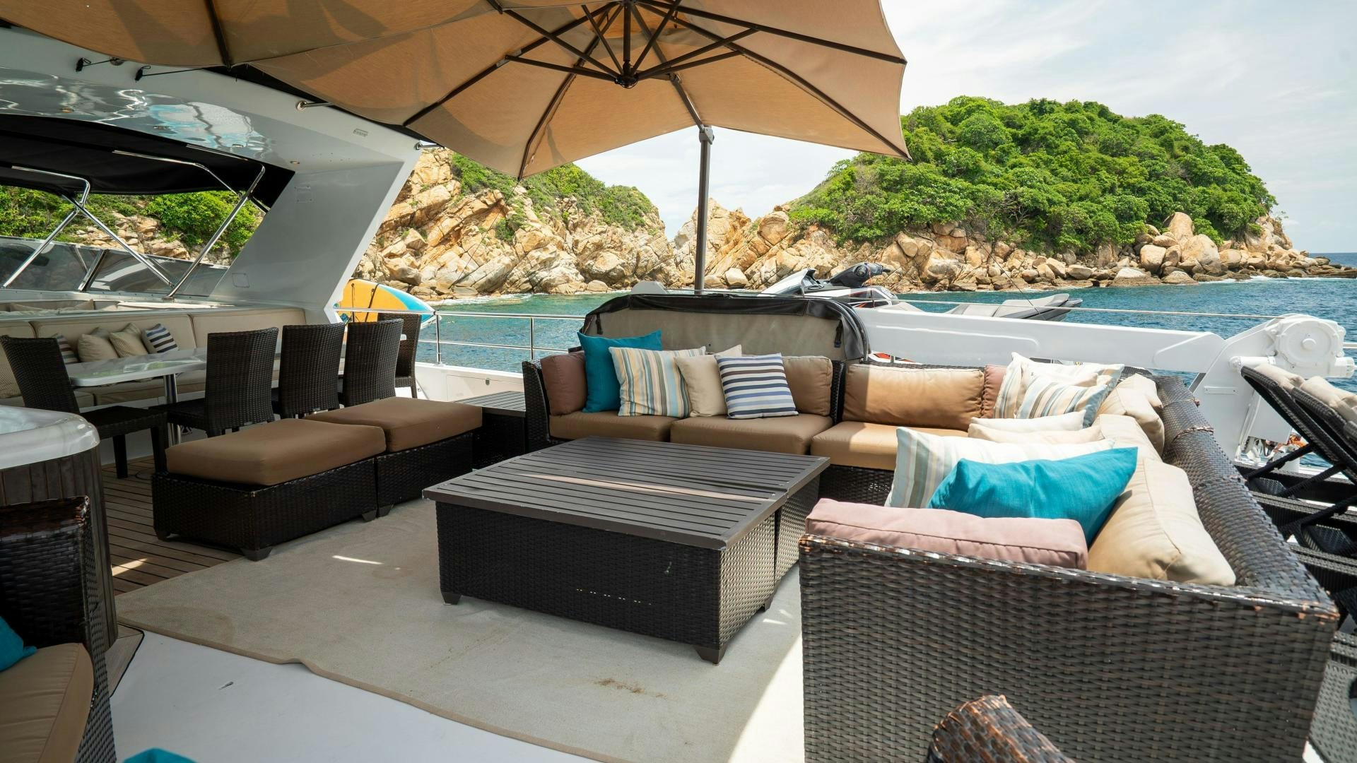 a patio with couches and chairs aboard MARAZUL Yacht for Sale