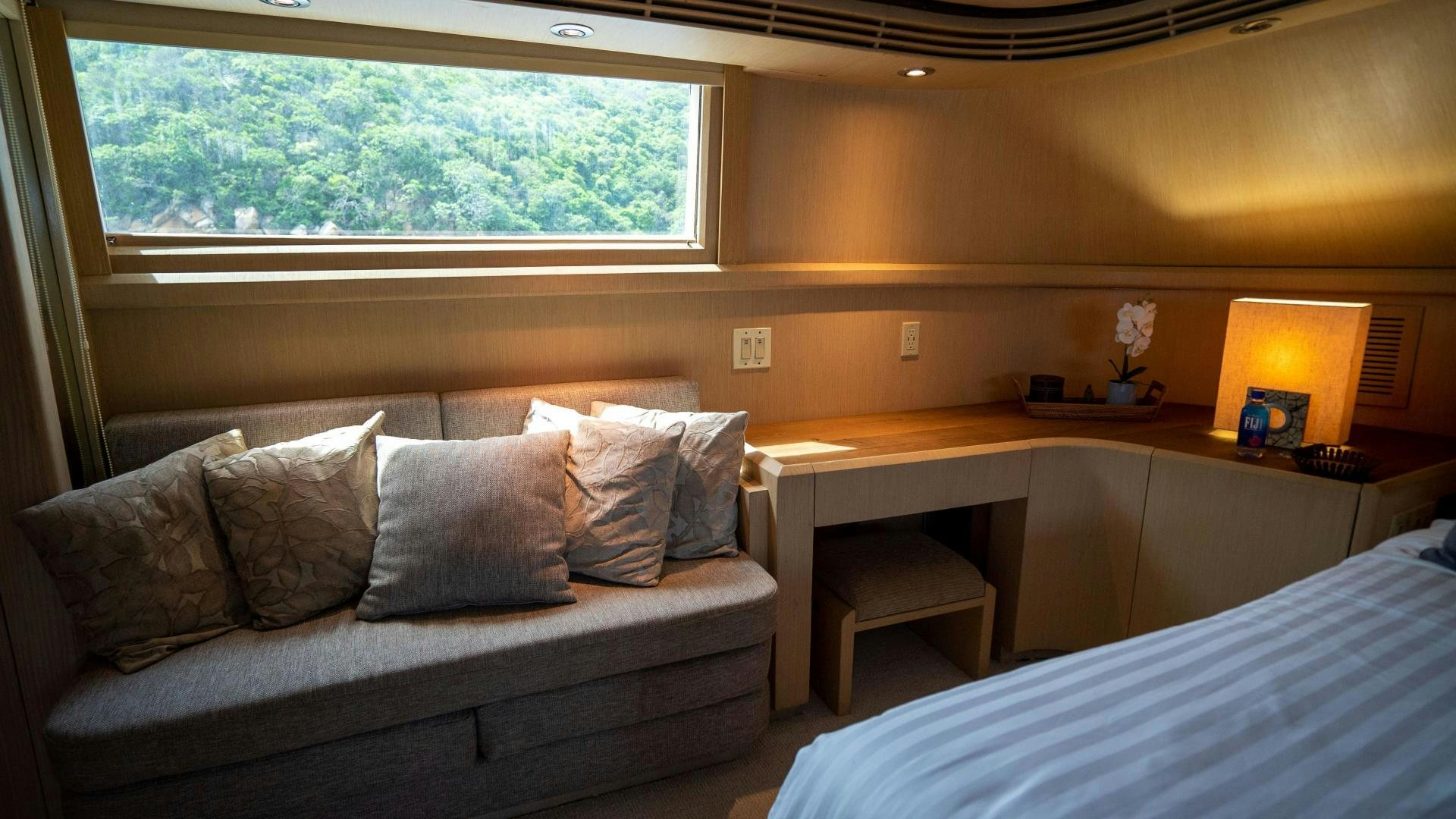 a bed and a couch in a room aboard MARAZUL Yacht for Sale