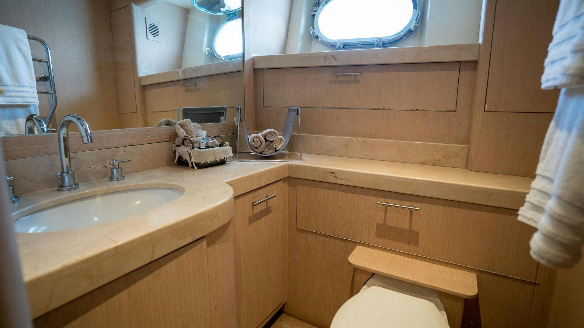 a bathroom with a sink and a toilet aboard MARAZUL Yacht for Sale