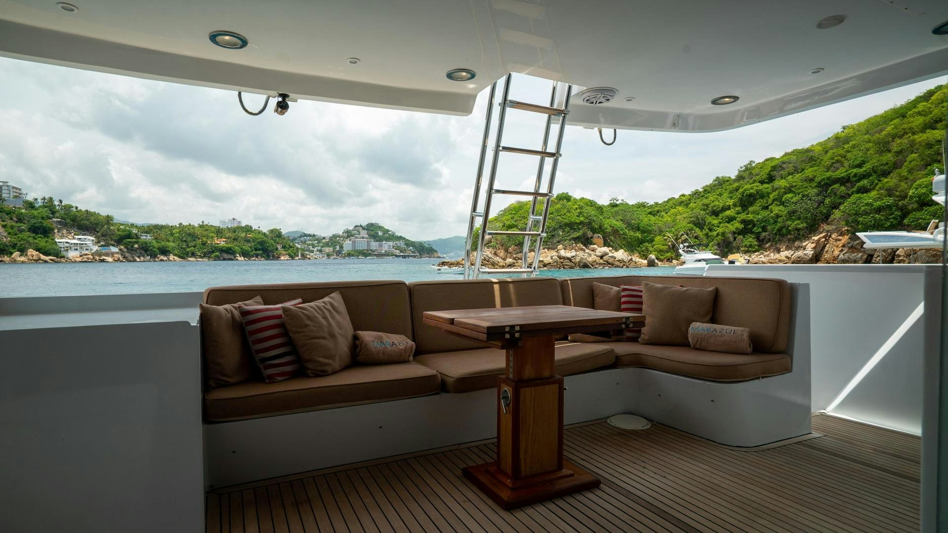a room with a couch and a table and a chair aboard MARAZUL Yacht for Sale
