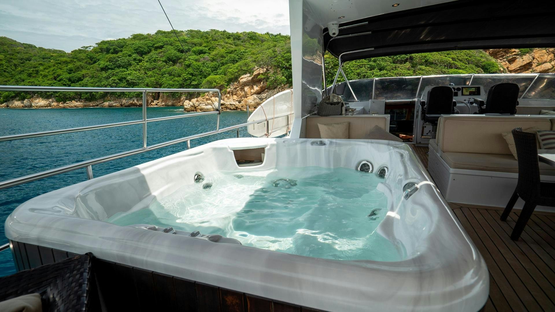 a large pool with a deck and a deck and a deck aboard MARAZUL Yacht for Sale