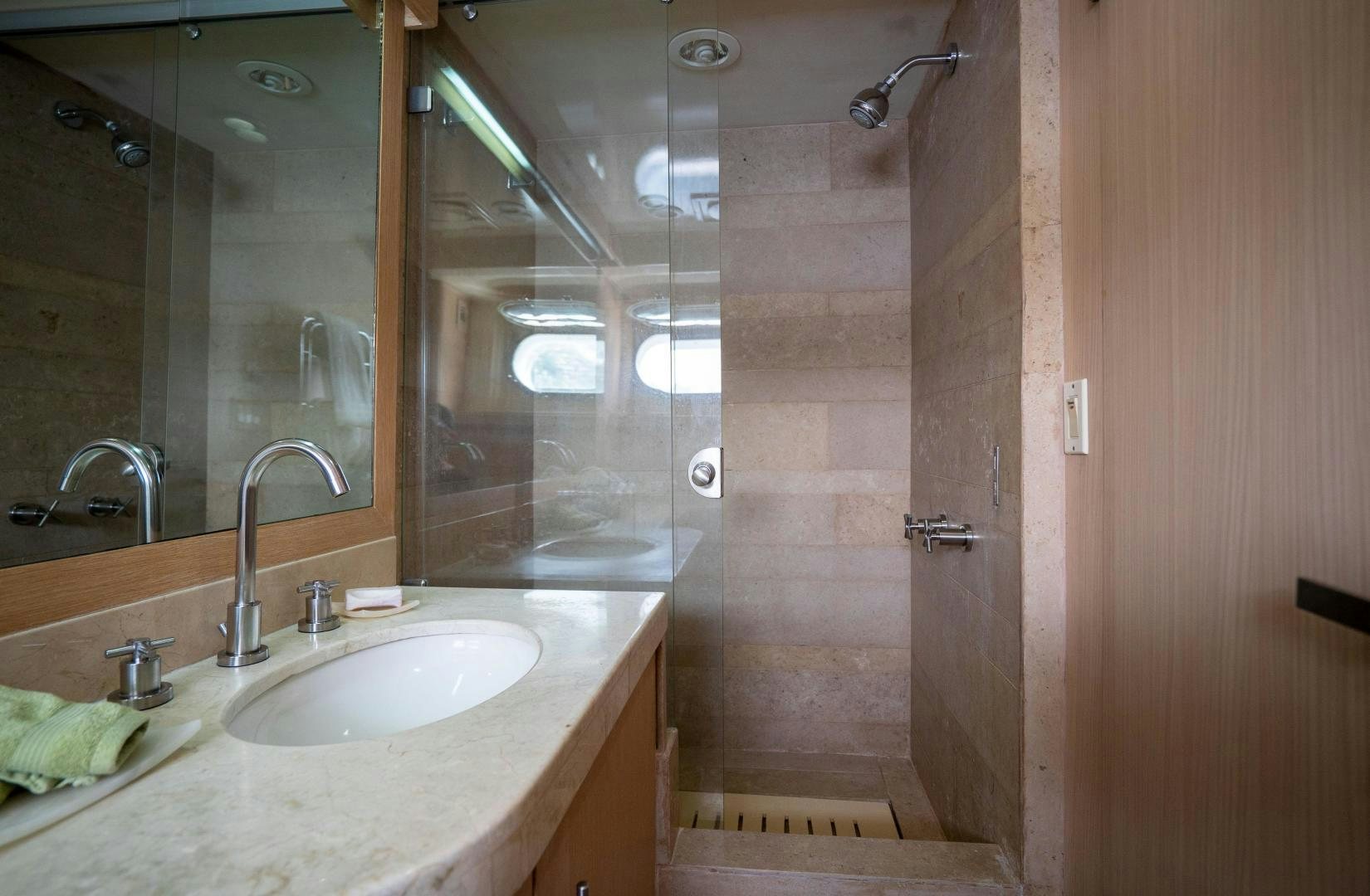 a bathroom with a sink and a shower aboard MARAZUL Yacht for Sale