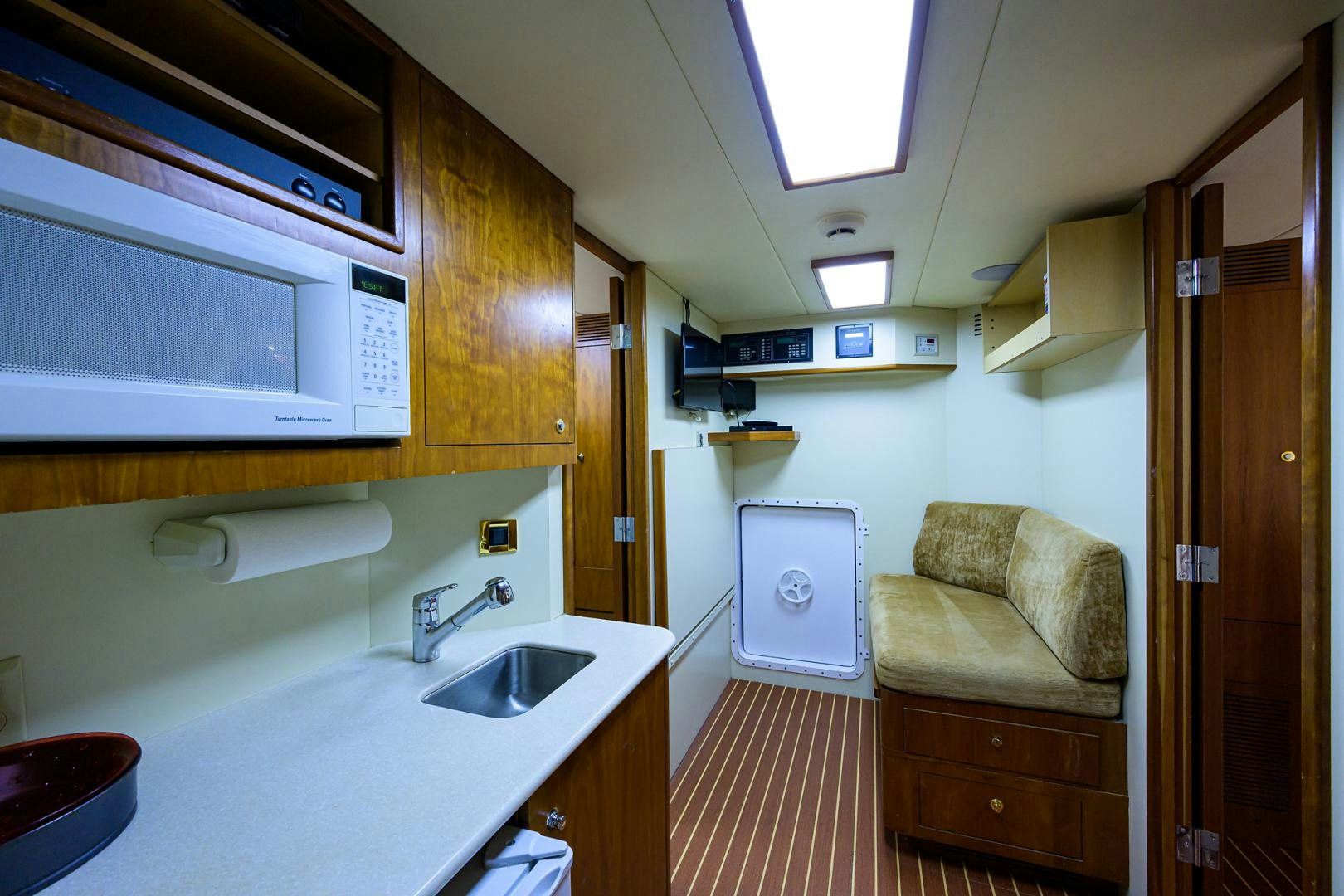 a kitchen with a microwave oven and a sink aboard MY DESTINY Yacht for Sale