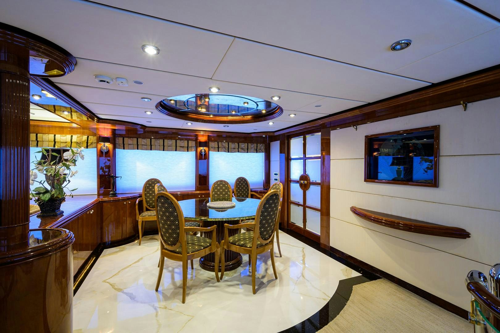 a large room with a table and chairs aboard MY DESTINY Yacht for Sale