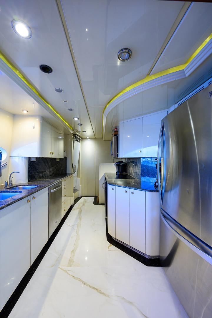 a kitchen with a large stainless steel refrigerator aboard MY DESTINY Yacht for Sale