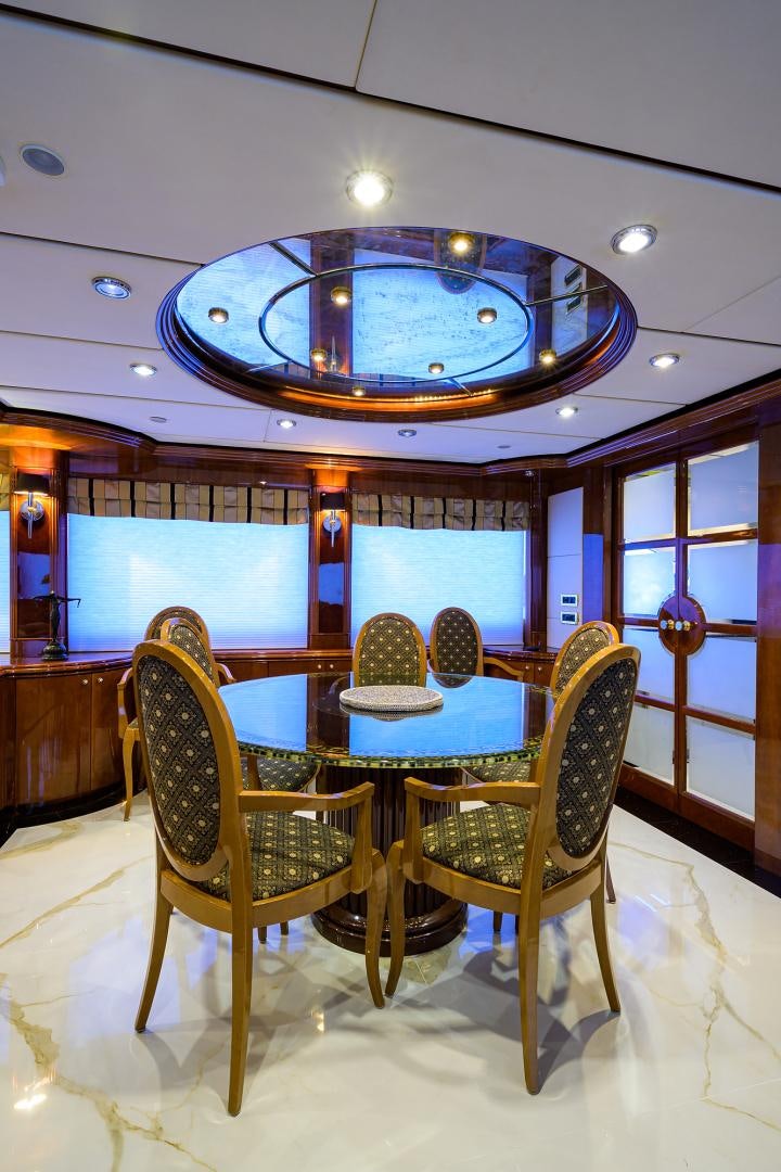 a room with a table and chairs aboard MY DESTINY Yacht for Sale