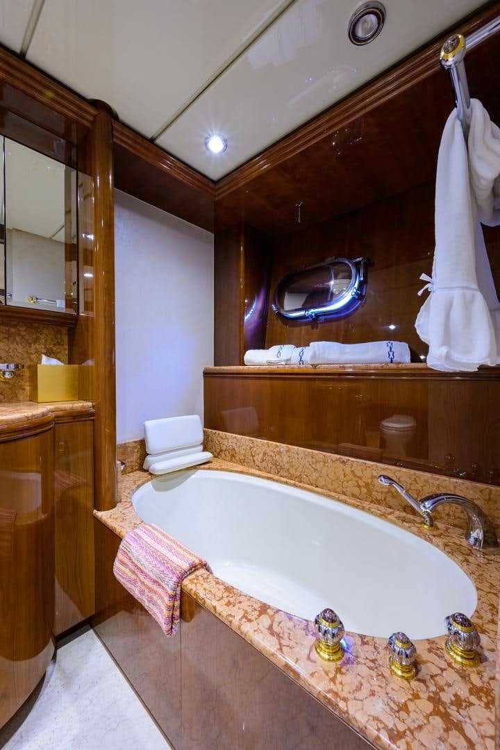 a bathroom with a bathtub and a sink aboard MY DESTINY Yacht for Sale