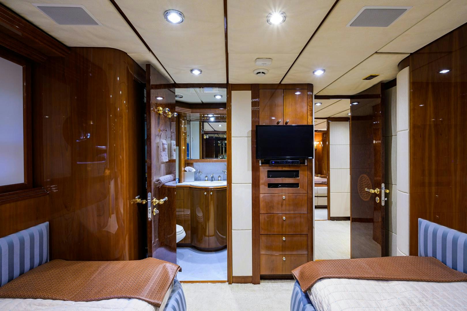a hotel room with a bed and tv aboard MY DESTINY Yacht for Sale