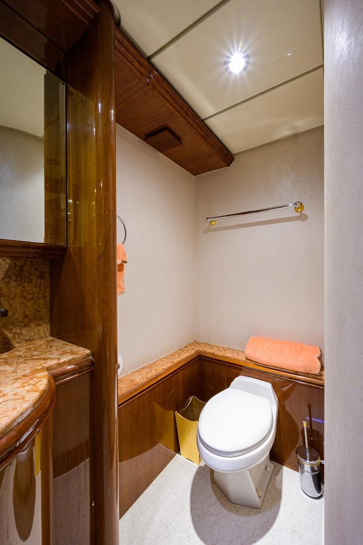 a bathroom with a toilet and sink aboard MY DESTINY Yacht for Sale