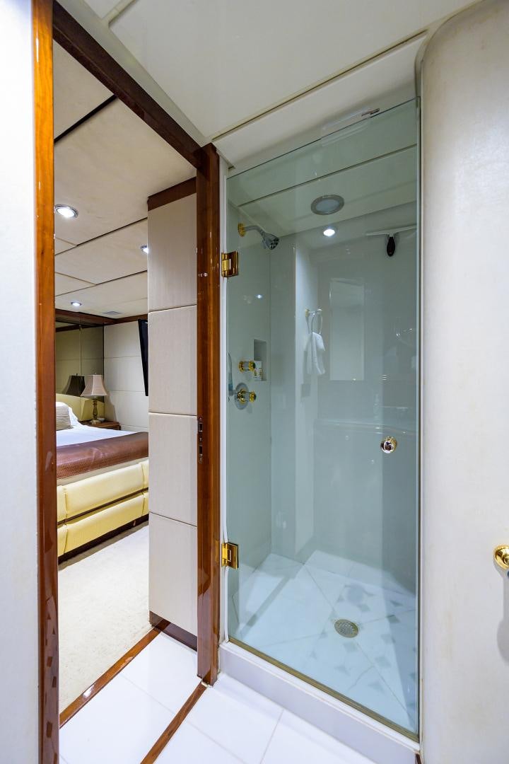 a bathroom with a glass shower aboard MY DESTINY Yacht for Sale
