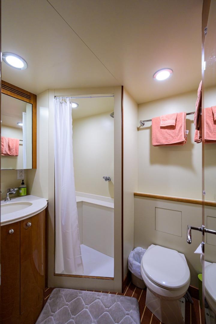 a bathroom with a shower and toilet aboard MY DESTINY Yacht for Sale