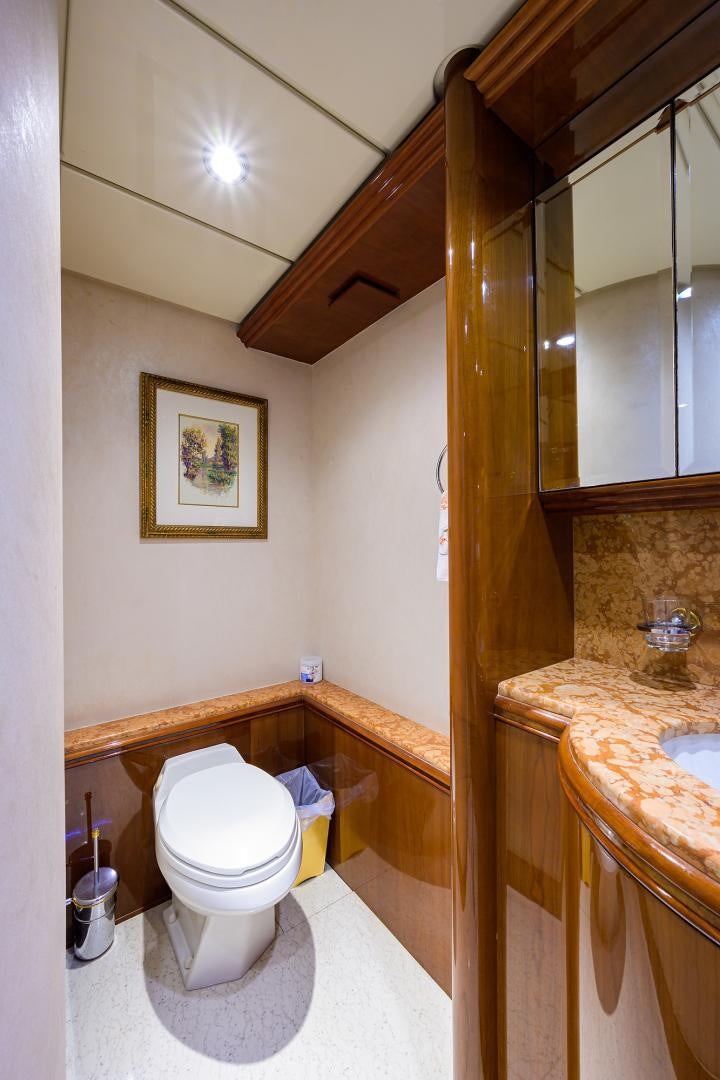 a bathroom with a toilet and a sink aboard MY DESTINY Yacht for Sale