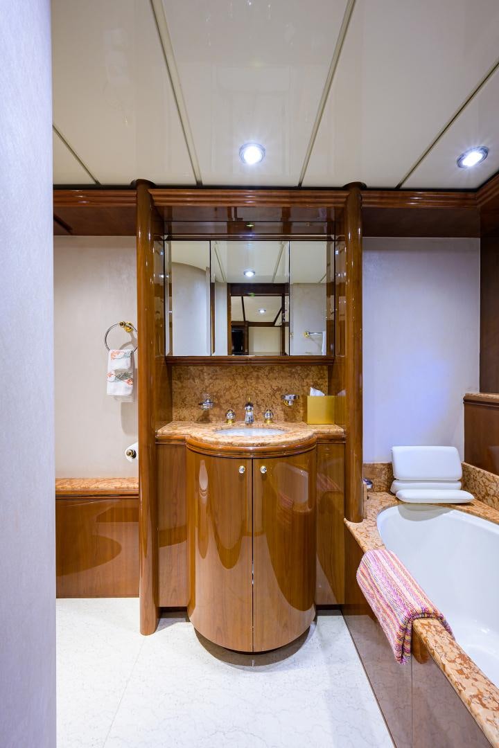a bathroom with a sink and a mirror aboard MY DESTINY Yacht for Sale