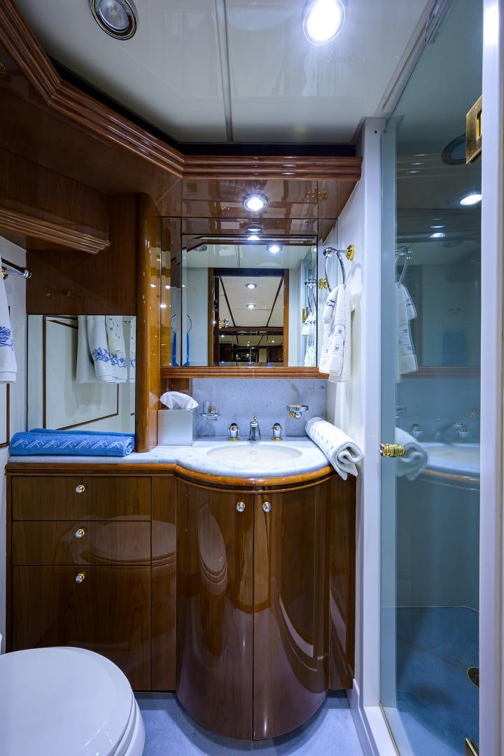 a bathroom with a sink and a mirror aboard MY DESTINY Yacht for Sale