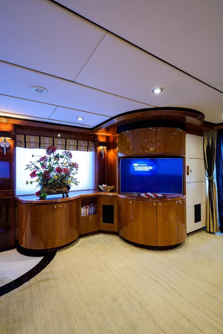 a tv on a stand in a room aboard MY DESTINY Yacht for Sale