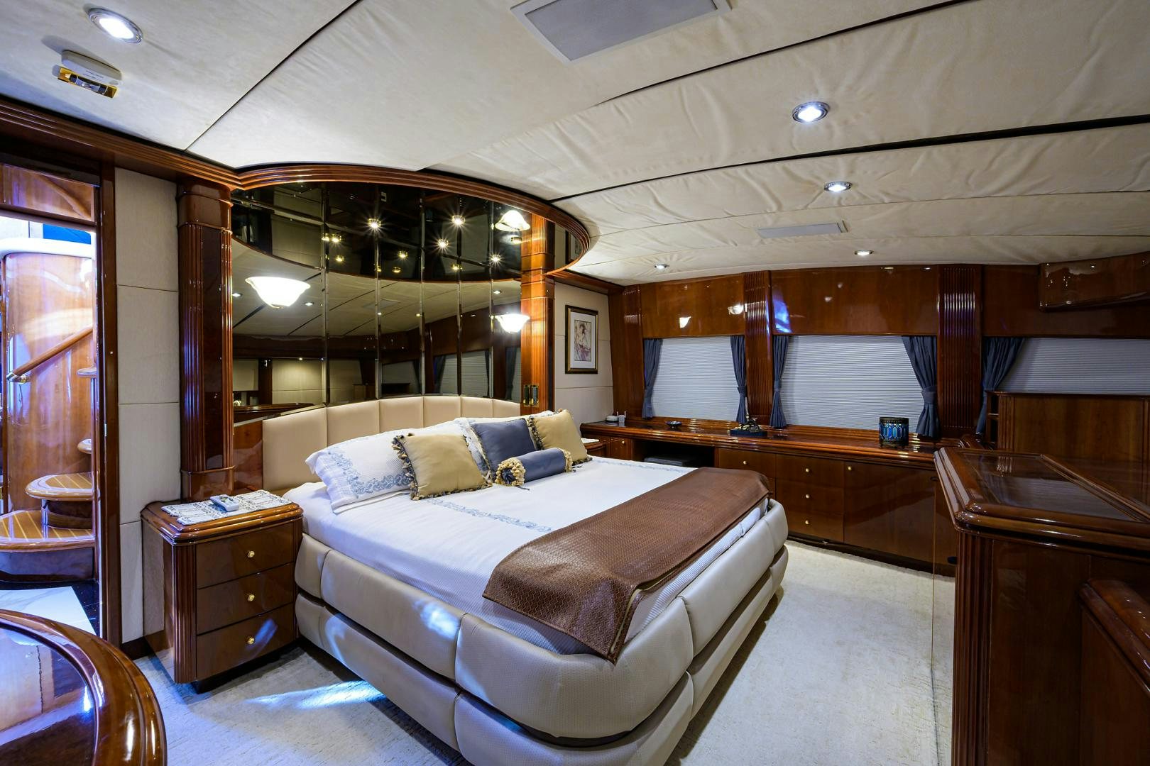 a bedroom with a bed and a desk aboard MY DESTINY Yacht for Sale
