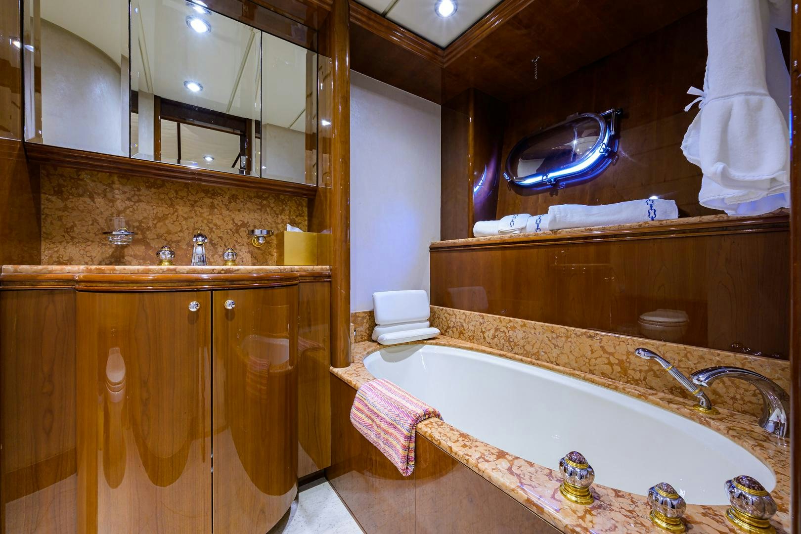 a bathroom with a bathtub and sinks aboard MY DESTINY Yacht for Sale