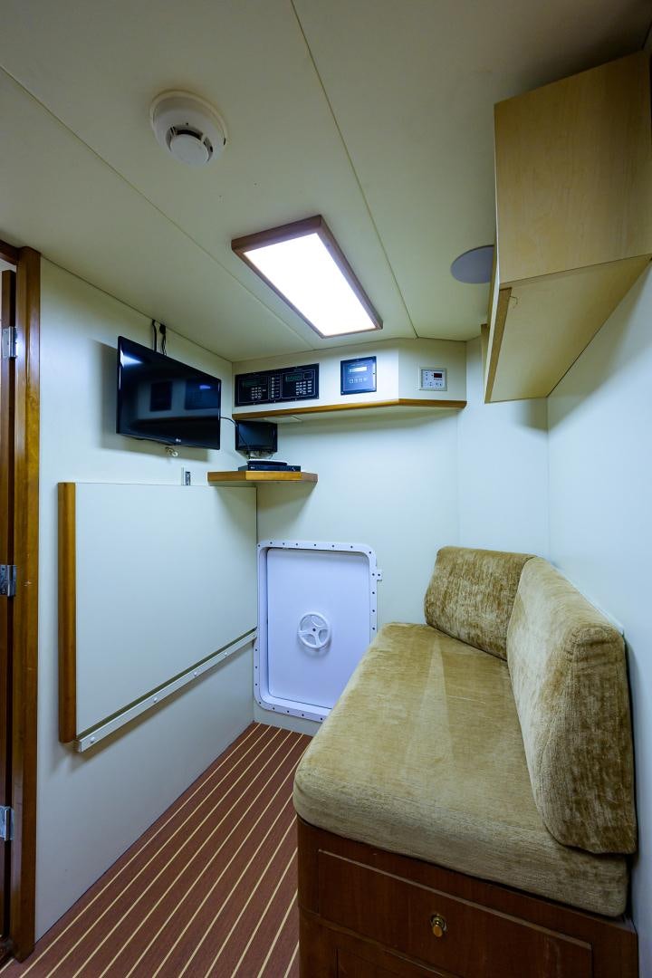 a room with a couch and a tv on the wall aboard MY DESTINY Yacht for Sale
