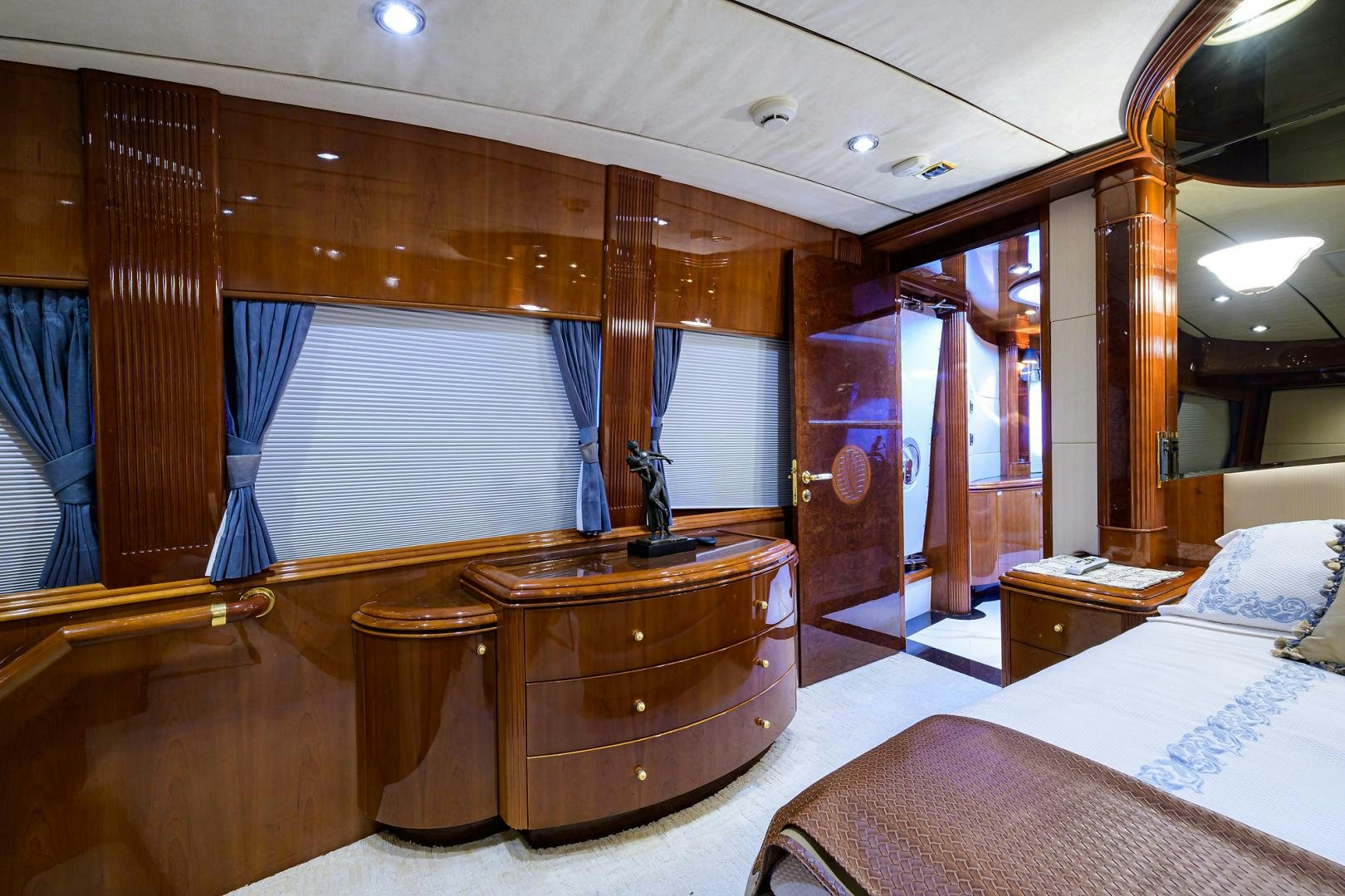 a room with a bed and a desk aboard MY DESTINY Yacht for Sale