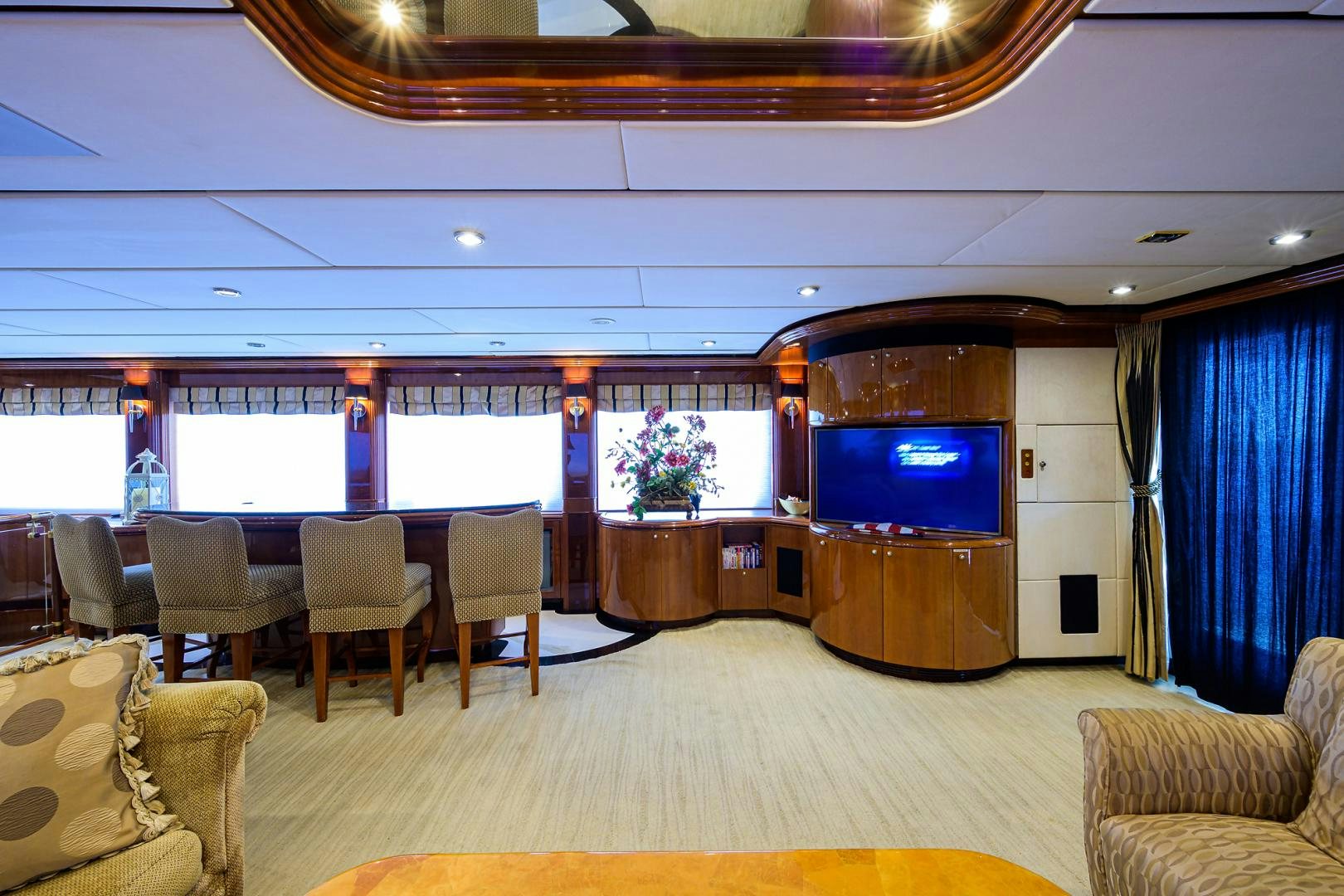 a large room with a tv and chairs aboard MY DESTINY Yacht for Sale