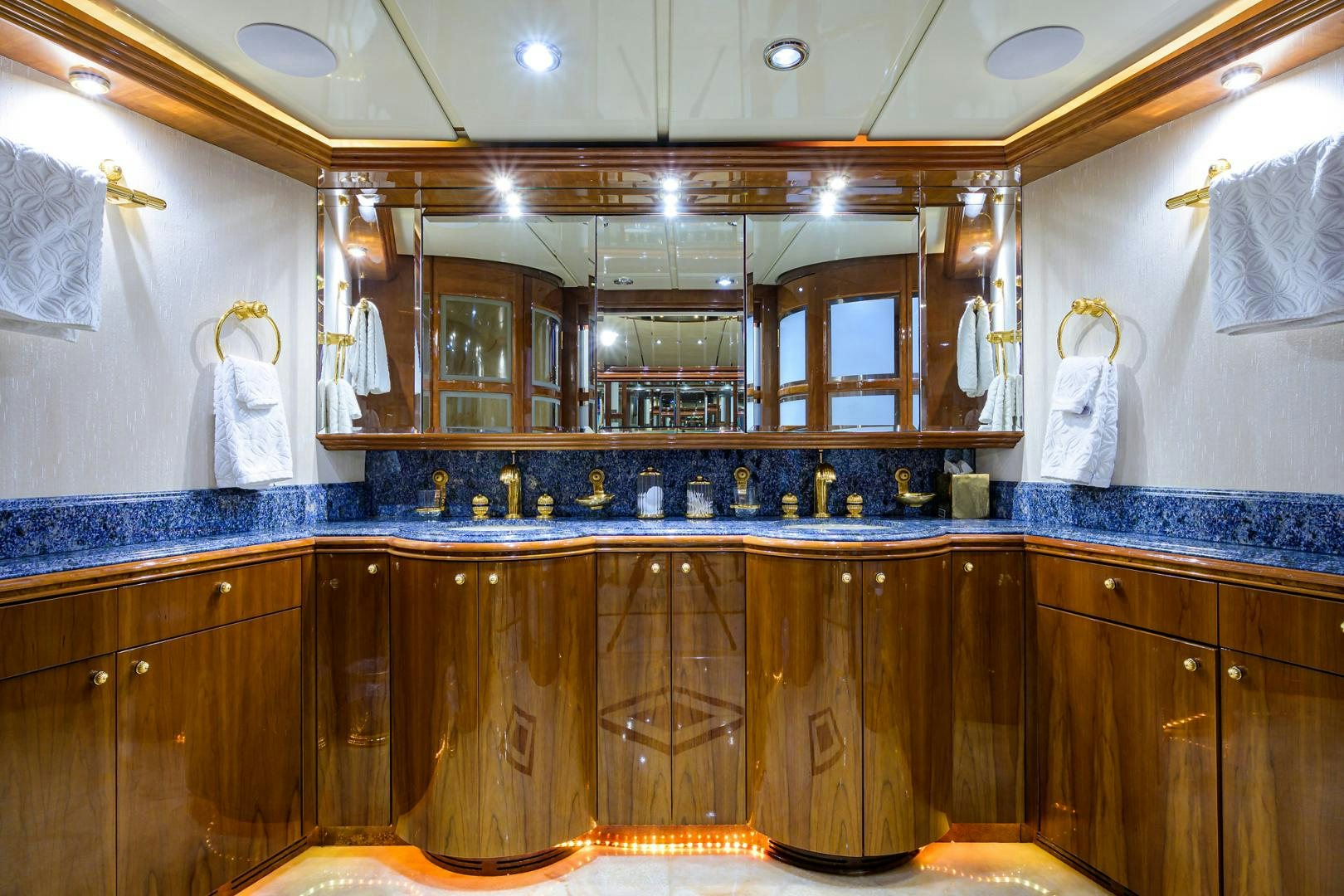 a bathroom with a large mirror aboard MY DESTINY Yacht for Sale