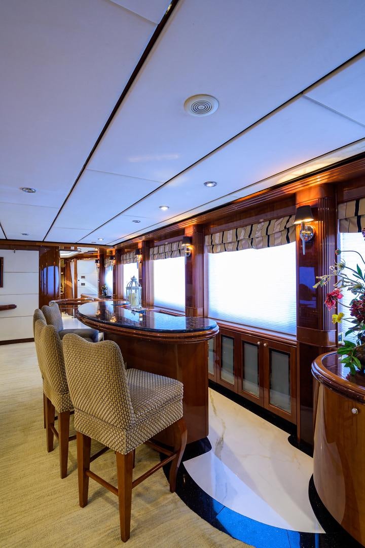 a room with a table and chairs aboard MY DESTINY Yacht for Sale